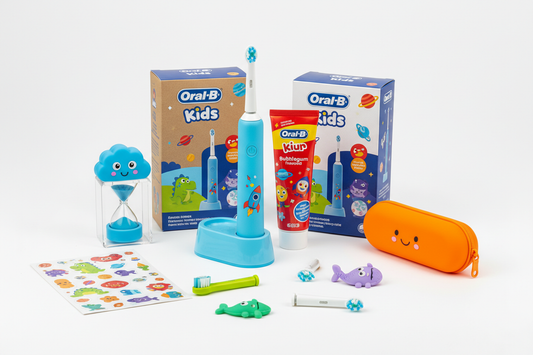 Oral-B kids electric power toothbrush bundle with toothpaste and accessories on white background