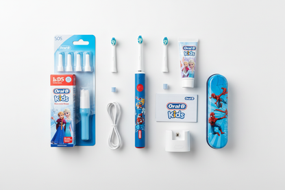 Oral-B kids power toothbrush bundle flat lay showing all included items on white background